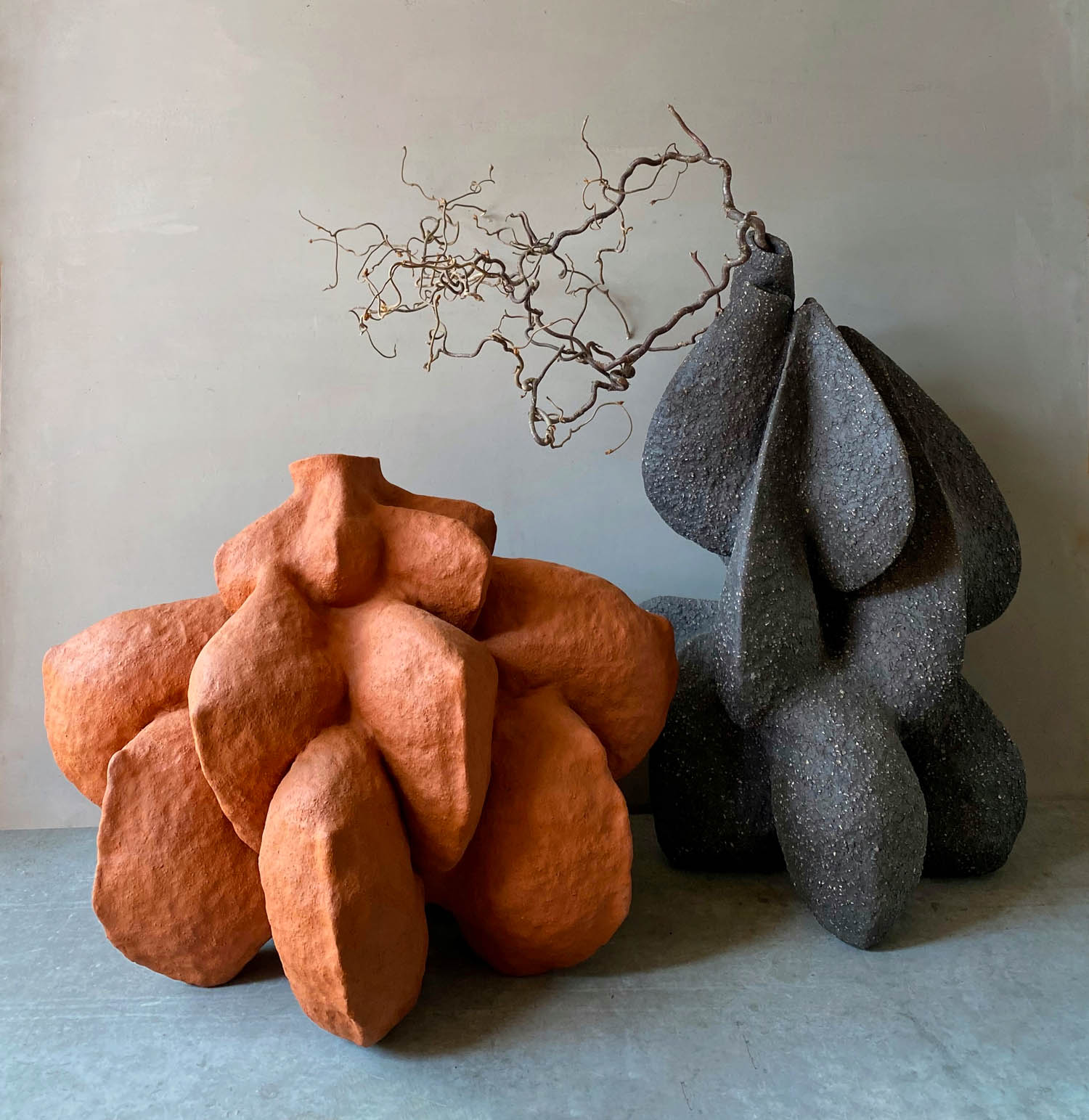 Biomorphic shapes in orange and gray.