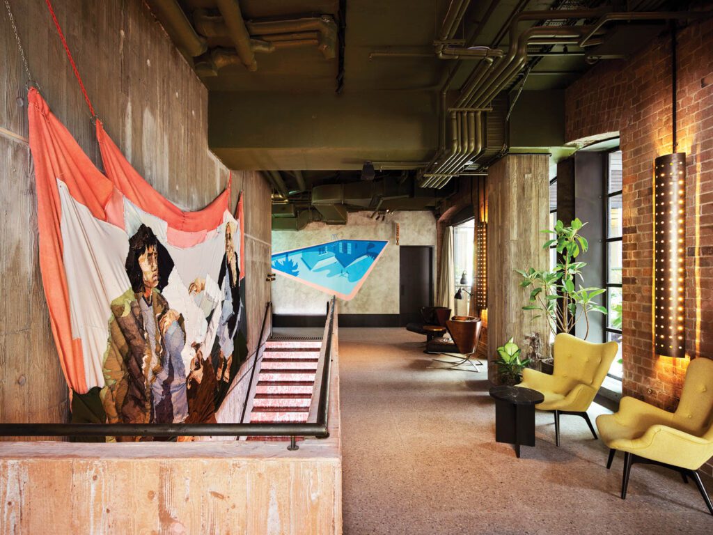 Commissioned artworks by Julia Gutman (left) and Joanna Lamb (back) enliven a pre-event space accessed by a honed Rosso Francia marble staircase.