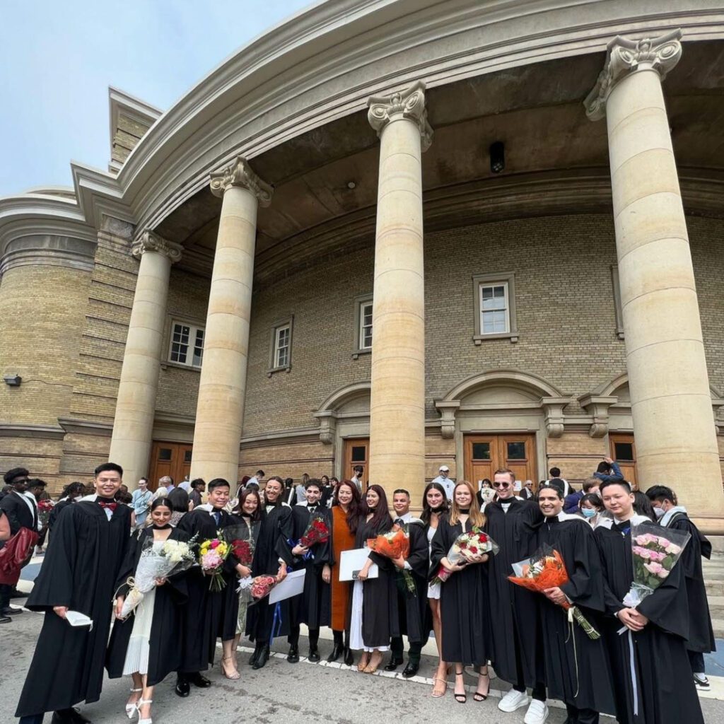 Juan Du with Class of 2022 undergraduate and graduate students outside Convocation Hall, University of Toronto.
