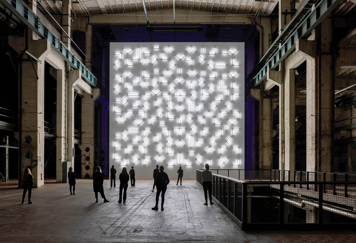 Visitors walk past the installation, Light and Space by Robert Irwin