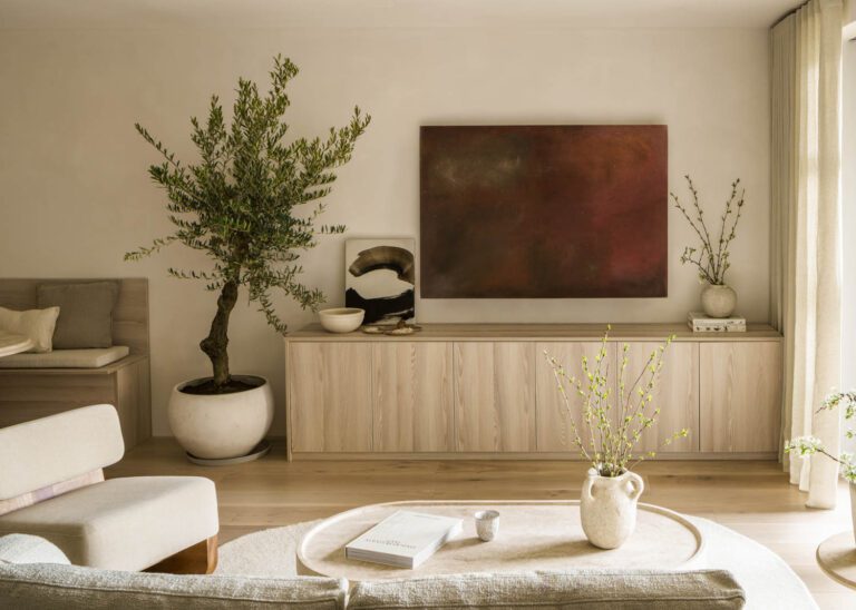 Sofa, coffee table, side table and accent chair by Tom Lawrence-Levy of Natural Asthetik. The TV Console is custom made. Large reddish artwork is by Lorenzo Brinati, from Cadogan Contemporary. The smaller piece is by Richard Zinon, also from Cadogan Contemporary.