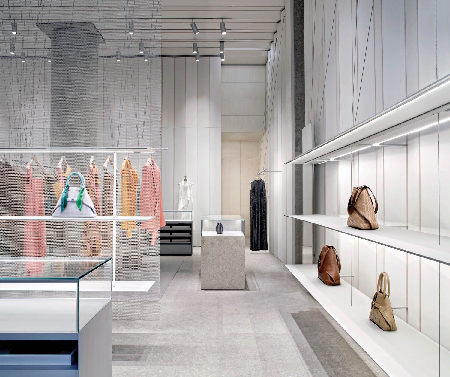 clothing ranks hang in the Akris store in Washington by David Chipperfield Architects