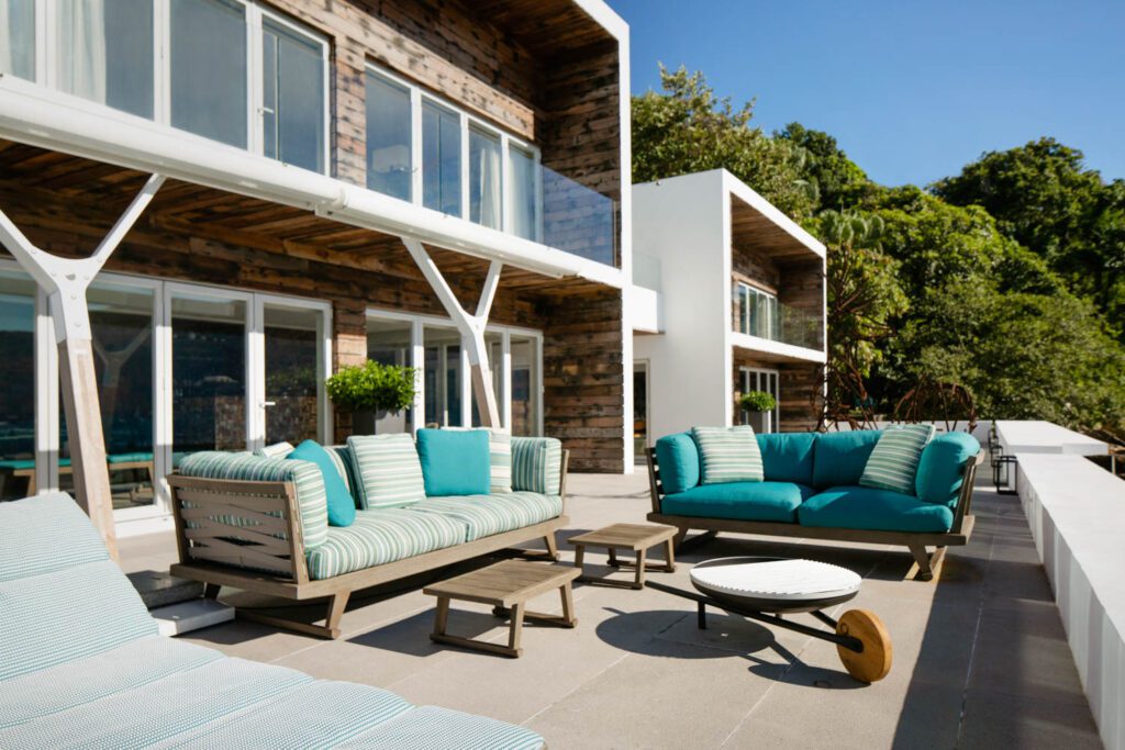 An outdoor lounge area at Ooak Lamma face the sea and Deer Island