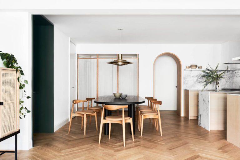 A Preben Fabricius & Jørgen Kastholm pendant hangs above a Bludot dining table and chairs by Carl Hansen & Søn.