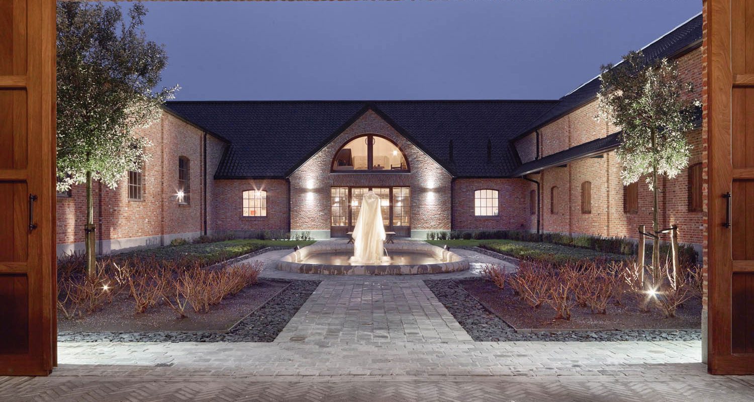 The newly landscaped private courtyard between the stable and the residence centers on an existing fountain.