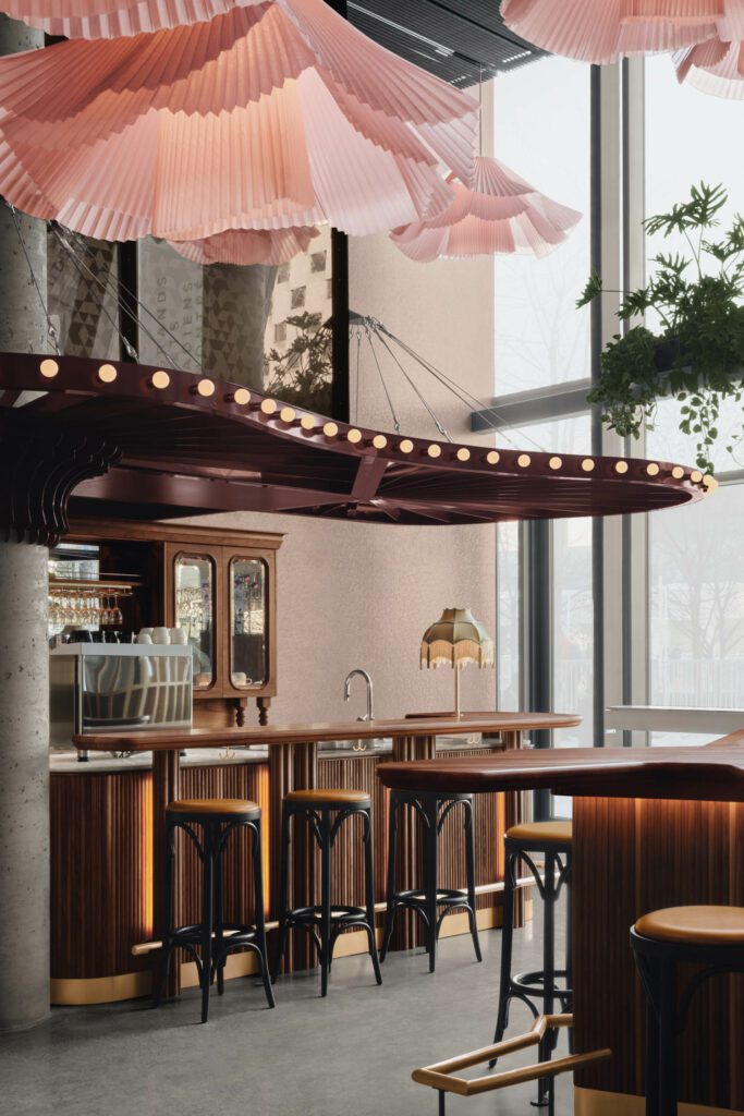 A marquise was inserted above the bar area to create a sense of intimacy in a space with high ceilings.