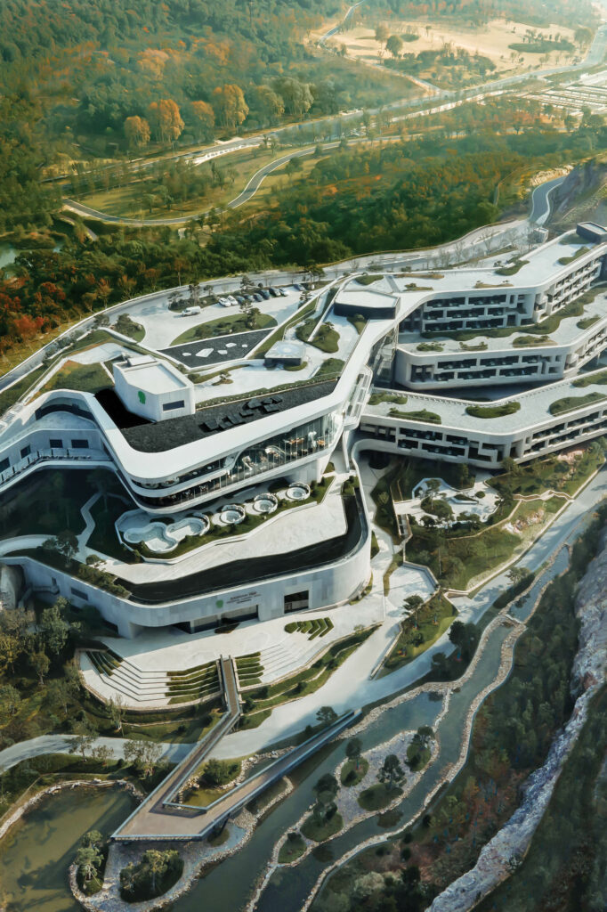 China Architecture Design & Research Group’s form for the hotel follows the man-made tiered contours of the quarry, which step down to the landscaped valley.