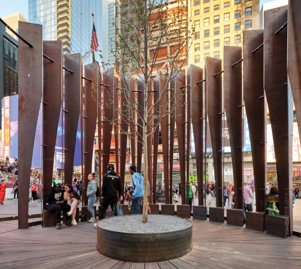 The tree sat in a basin of hot-rolled weathering steel at the center of the 24-foot-diameter pavilion