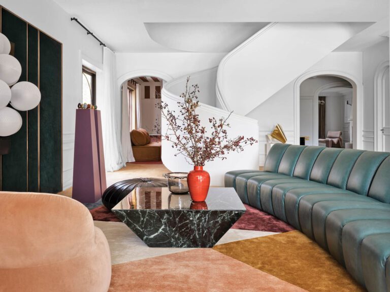 Accompanying an Esedra pouf by Monica Förster and a marble coffee table, the family room’s leather-clad custom sectional modules can be reconfigured over time as the clients’ needs change.