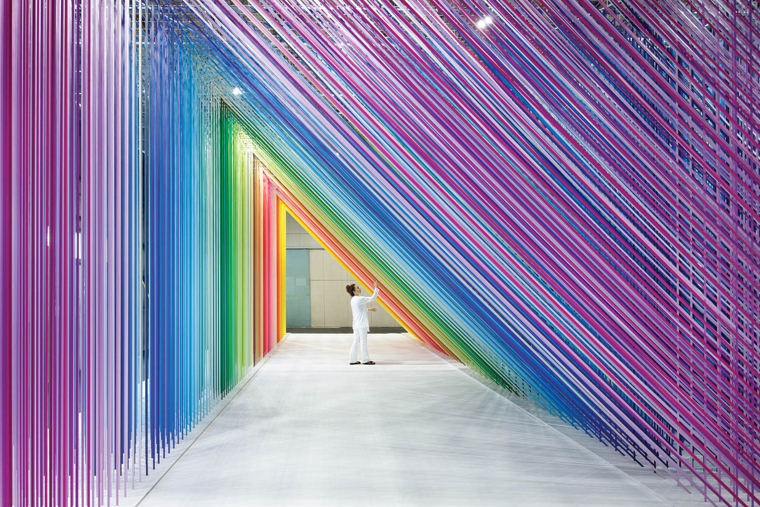 tunnel takes the shape of a right scalene triangle in Emmanuelle Moureaux Architecture + Design’s 100 Colors no.35 for Japanese masking tape brand MT’s factory in Kurashiki, Japan.