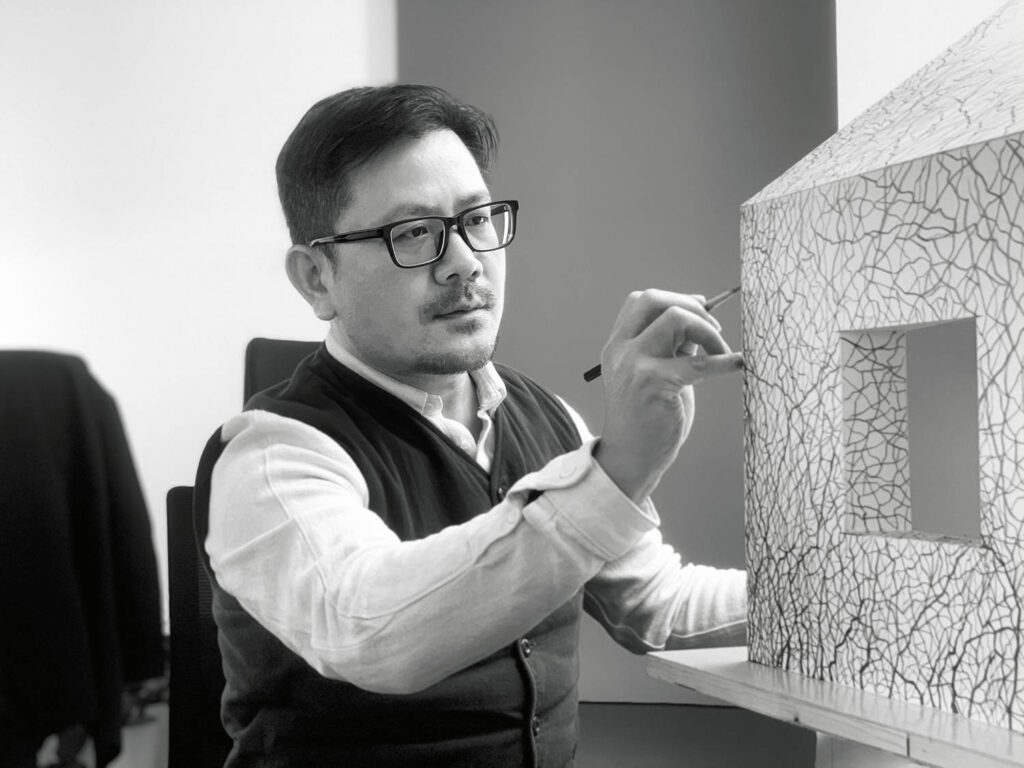chief designer Quanchun Hu at work on the model. 