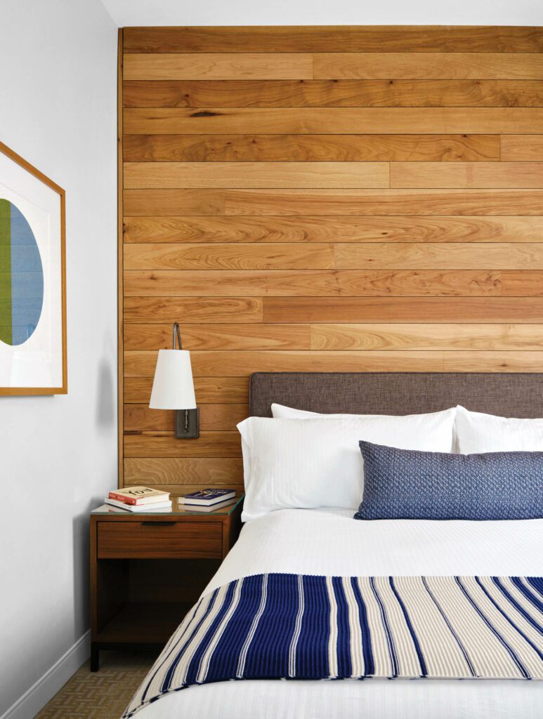 the hotel guest room with pecan paneling