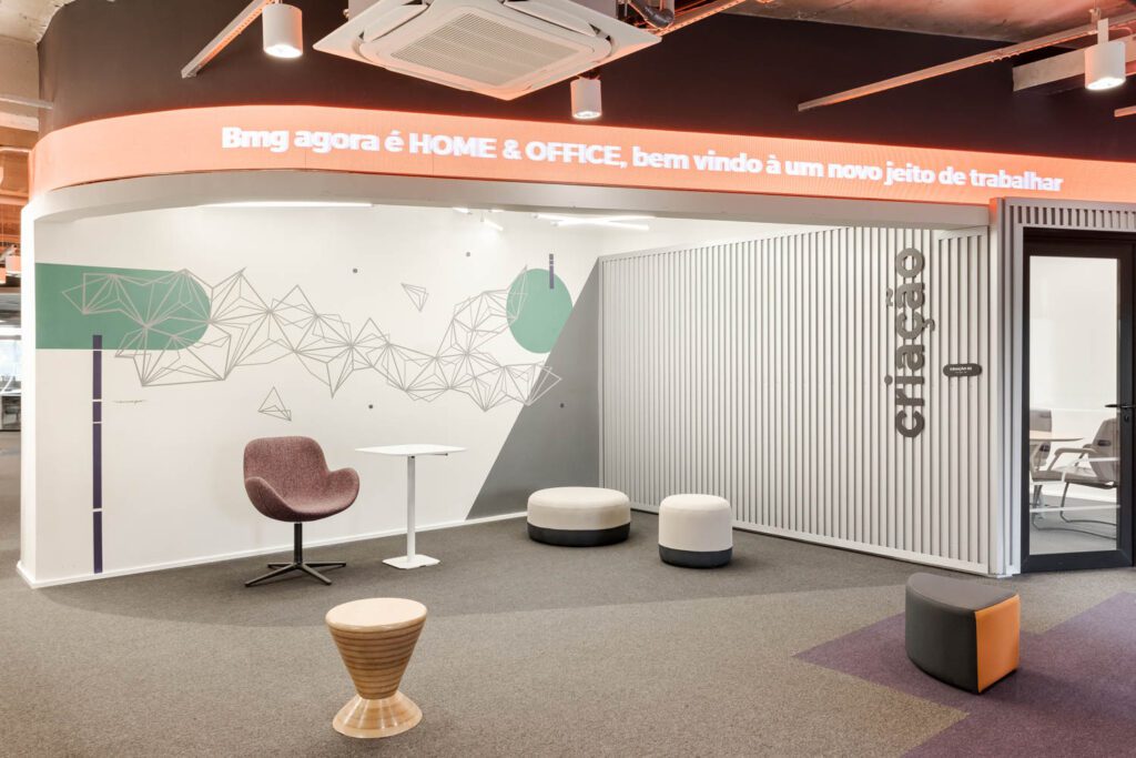 A creative meeting space boasts a chair by Herman Miller and Teto poufs.