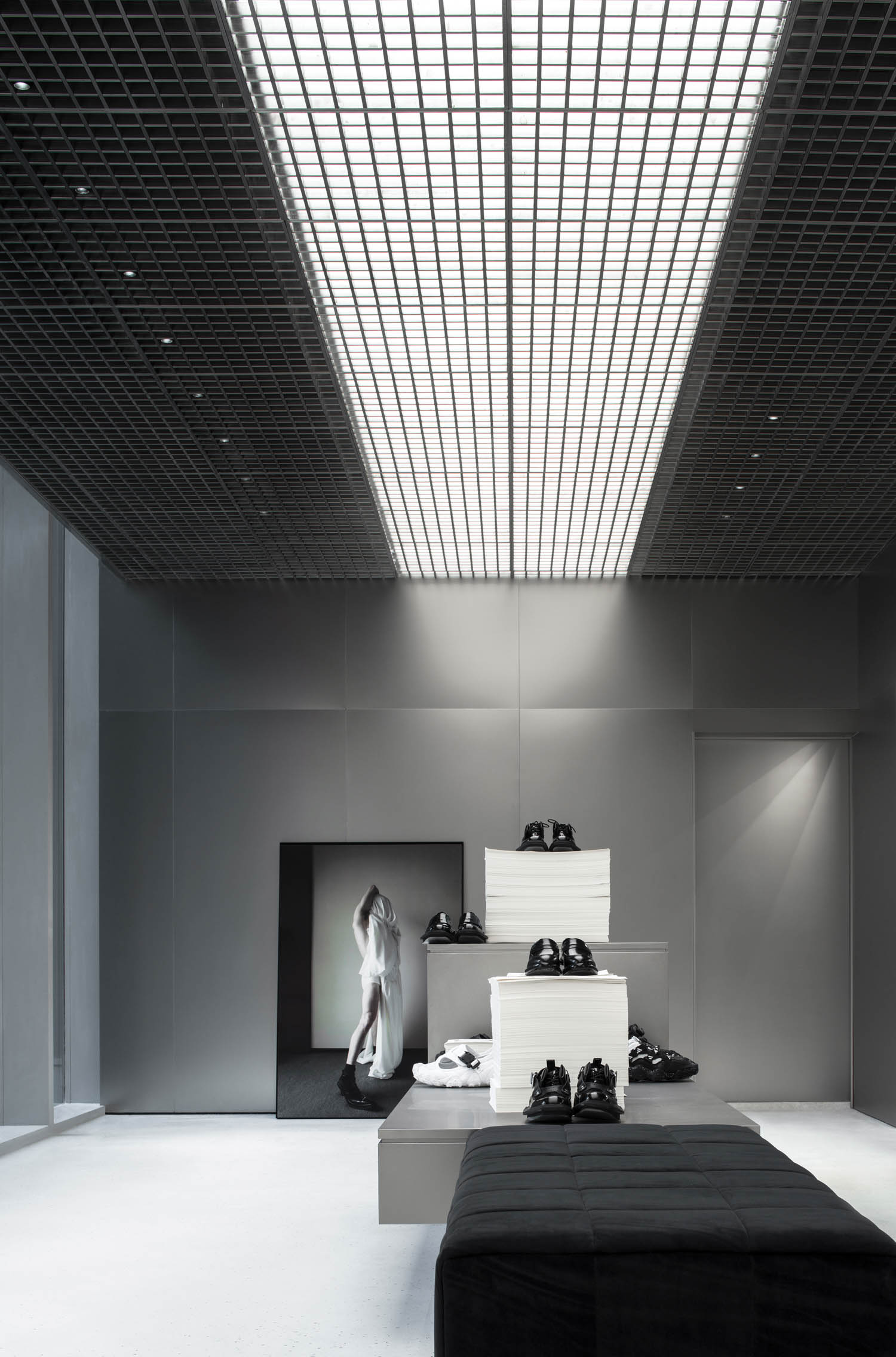 shoes sit on tiered structures in the Hug concept store in Chengdu, China by Atmosphere Architects