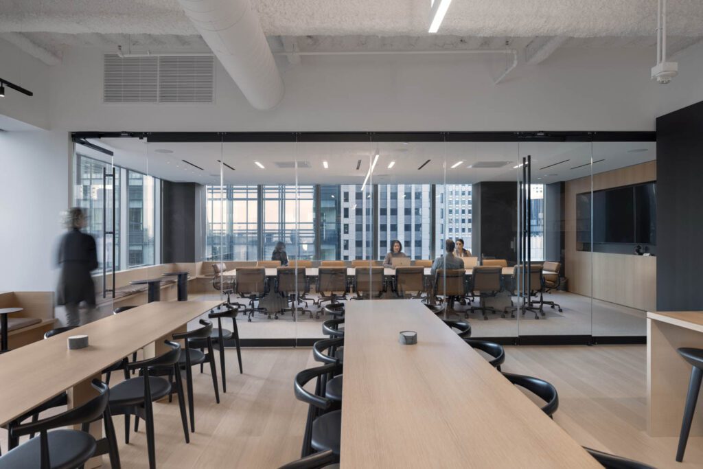 The board room’s stacked glass panels allow it to be conjoined with the collaboration-dining zone.