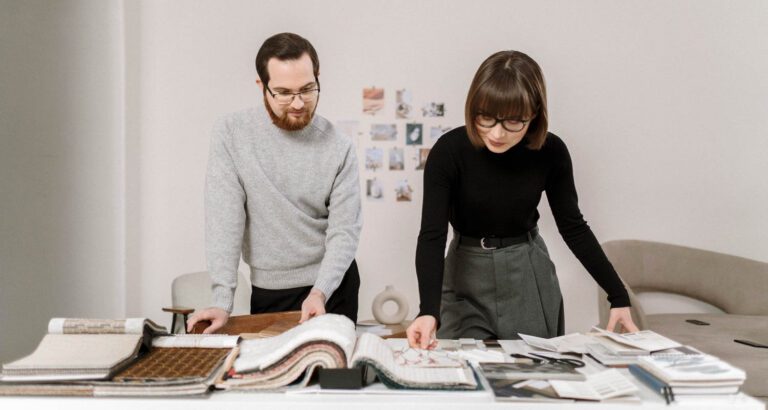 designers looking at a book together